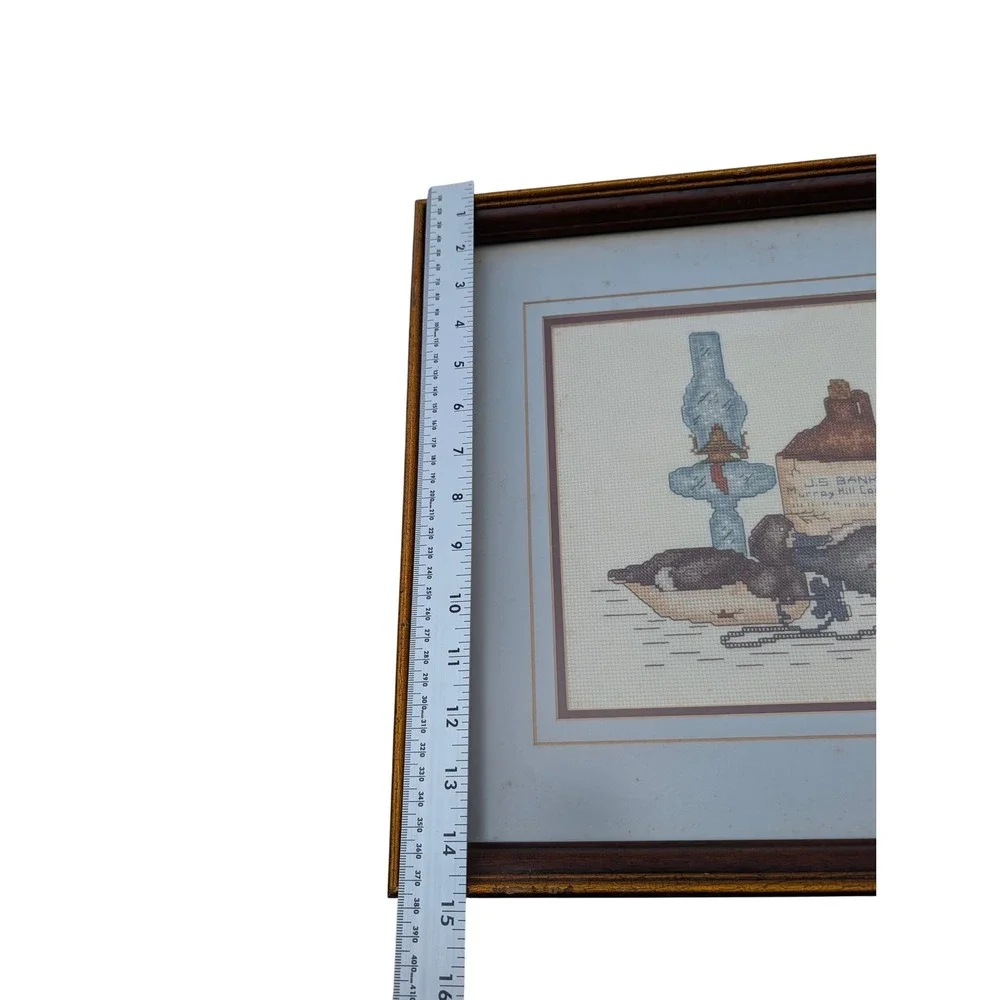 Vintage Framed Cross Stitch Duck Decoy Whiskey Jug Oil Lamp Needlepoint Art